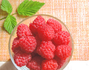 Fresh Raspberries background. Strawberry. Food background.Copy space. Top view, healthy food for breakfast. Eco, organic summer diet food. Ripe Raspberries from garden in a mug .Summer Raspberries . 