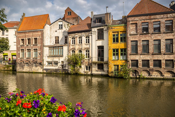 Fototapeta na wymiar Historic buildings next to the river in the Ghent city center, Belgium