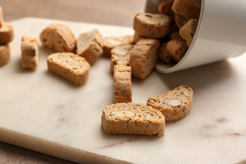 Tasty Italian biscotti on light board, closeup