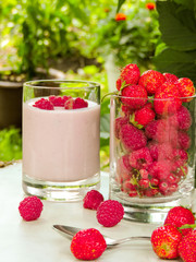 Set of various fresh summer berries. Close up, selective focus.Summer healthy fruit. Food pattern.Summer Food Concept. Homemade yogurt with fresh strawberry and  raspberries.Top view.berry fruit.
