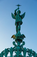 Fototapeta premium Statue of Saint Michel on basilique Notre-Dame de Fourvière, Lyon, France.