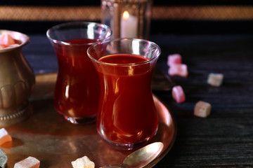 Glasses of tasty Turkish tea on table