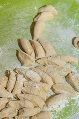 Sliced raw dough prepared for cooking homemade dumplings