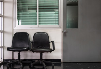 Fototapeta premium Double black chair in front of the manager room.