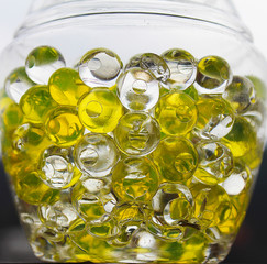 Yellow transparent bubbles in a glass jar