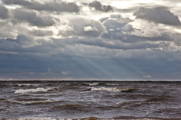Fototapeta na wymiar Stormy sea in cloudy weather