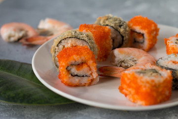 delicious sushi rolls with fresh fish caviar and soy sauce useful