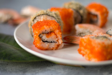 delicious sushi rolls with fresh fish caviar and soy sauce useful