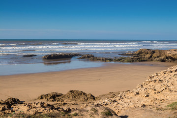 Fototapeta premium Sand and rocks on the beach, Morocco