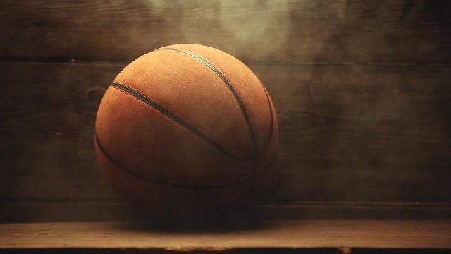 Basketball ball wooden desk smoke hd footage 