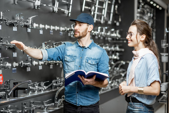 Woman With Salesman In The Plumbing Shop