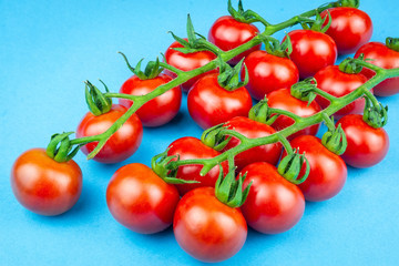 cherry tomatoes on blue background