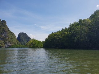 Fototapeta na wymiar Wonderful mountainous landscape at a kayak trip into the mangrove forest in Ao Thalaine in Krabi in Thailand, Asia