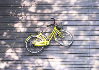 Bicycle lay down against wooden floor at Bang Kachao Island the community forest in Samut Prakhan Province, Thailand