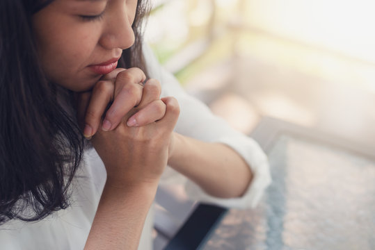 Asian woman believe in the prayer to God, Bible and christian study concept