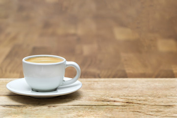 cup of coffee on wooden table. Copy space