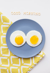two beautiful eggs on a plate