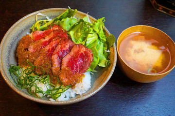  Delicious rice with medium rare beef and lettuce and ginger sauce Japanese traditional food raw slices of beef teriyaki sauce with miso soup bowl Asian cuisine 