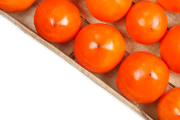 Fresh ripe persimmons in market. Persimmons background.