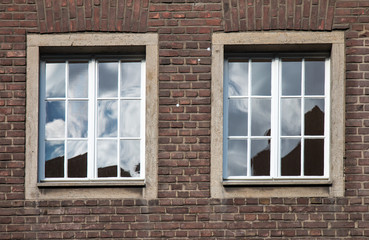 Windows on brick wall
