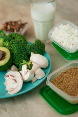 close up conception of vegetarian and healthy food in lunch green boxes in fridge with soft ligth