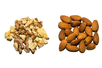 Close-up of walnut and almond. Fruits of walnuts and almonds. On white background. Isolated.