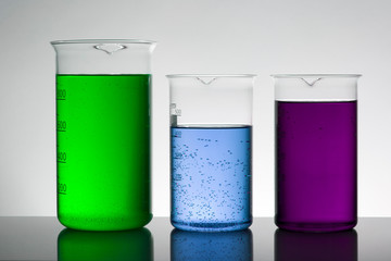 Liquid in laboratory bottles. Scientific biochemical laboratory. Colorful liquid.