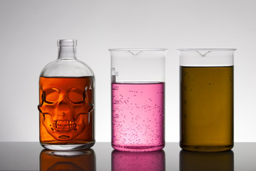 Liquid in laboratory bottles. Scientific biochemical laboratory. Colorful liquid.