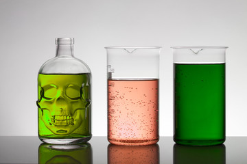 Liquid in laboratory bottles. Scientific biochemical laboratory. Colorful liquid.
