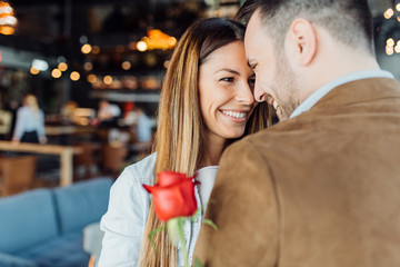 Beautiful elegant couple is hugging and smiling
