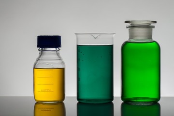 Liquid in laboratory bottles. Scientific biochemical laboratory. Colorful liquid.