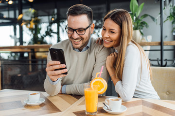 Romantic couple having rest in cafe