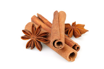 Dry stars anise fruit and cinnamon sticks isolated on white background