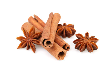 Dry stars anise fruit and cinnamon sticks isolated on white background