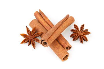 Dry stars anise fruit and cinnamon sticks isolated on white background