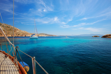 Idyllic bay in Mediterranean Sea, Sardinia, Italy. Sailing boats