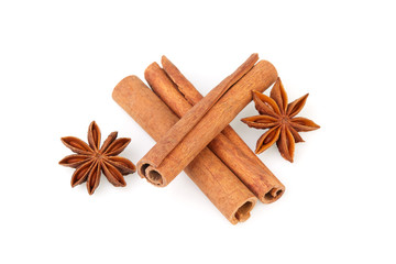 Dry stars anise fruit and cinnamon sticks isolated on white background