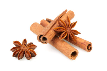 Dry stars anise fruit and cinnamon sticks isolated on white background