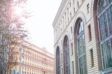 Naklejka premium A piece of cityscape in winter. Streets and buildings of a town in snow.