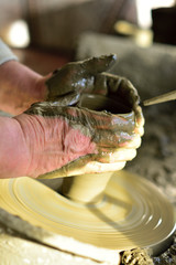 hands of a potter at work