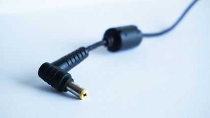Stereo audio cable in black for a computer and 1 xjack 1 xrca speakers on a white-blue background