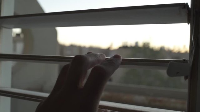 Looking through a window in an old and poor apartment building