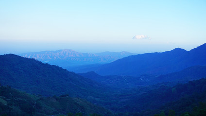    Mountain sunrise landscape in Minca, Colombia. Blue tones, endless mountains view before the sun is up