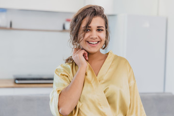 Beautiful girl in bathrobe relaxing at home.Young Woman In Her Morning Routine, After A Shower.Beautiful girl in bathrobe relaxing at home