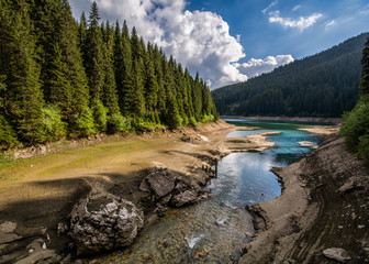Fototapeta na wymiar Bolboci lake inside Bucegi mountains , Romania Carpathian mountains