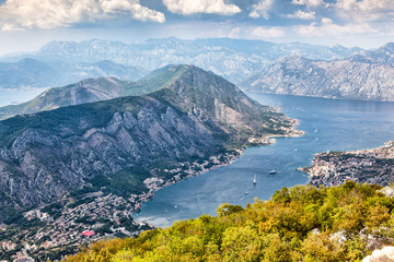 Panoramic view of the airport runway near the city, on the Adriatic Sea, from a great mountain height. Aerial view of Tivat, Kotor Bay, Montenegro.