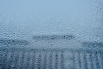 Background with water drops on the glass. Water vapor on the window