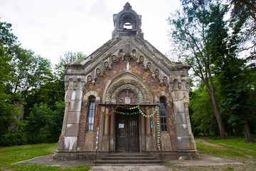 Fototapeta na wymiar Count Potocki family chapel and vault crypt in village Pechera, Ukraine, cloudy shadowless summer day, front view