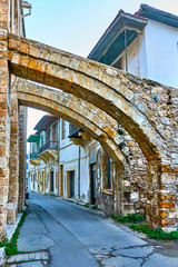 Old street in Larnaca under ancient buttresses of The Great mosque, Cyprus