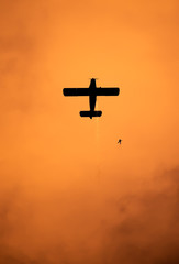 Airplane silhouette in the sky at sunset time during air show BIAS , Bucharest , Romania  